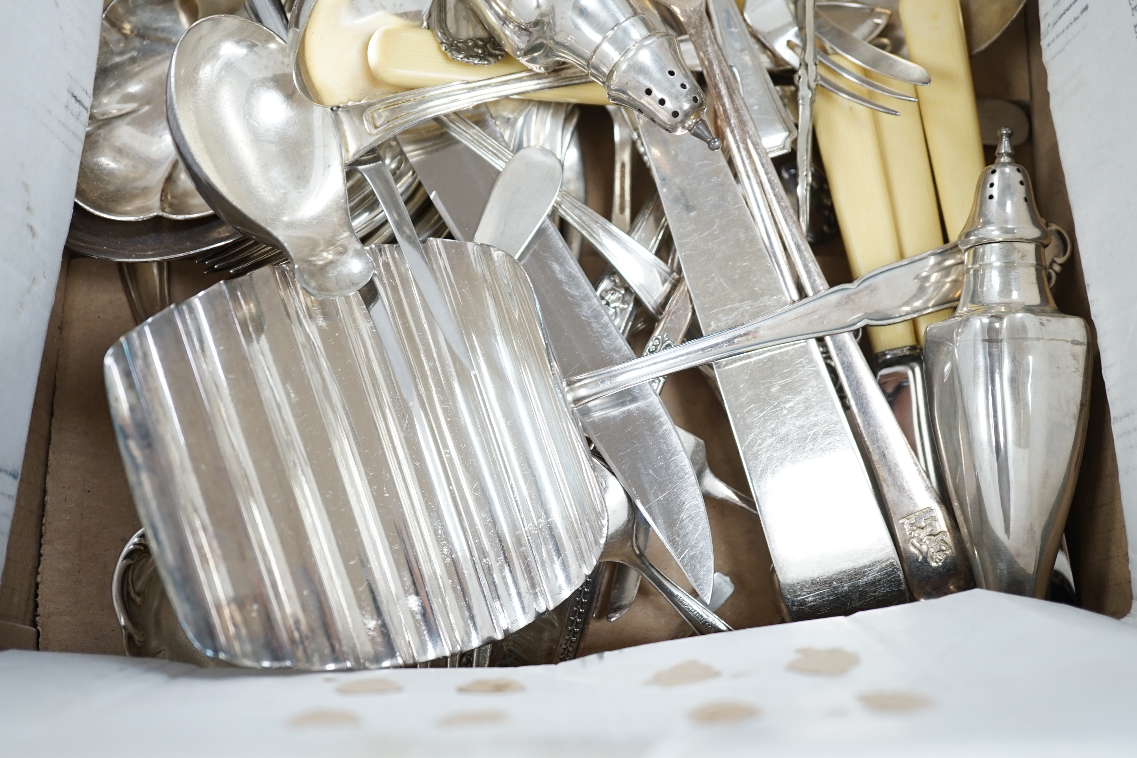 A pair of sterling pepperettes, five other sterling or 800 standard items of flatware and a quantity of silver plated flatware.